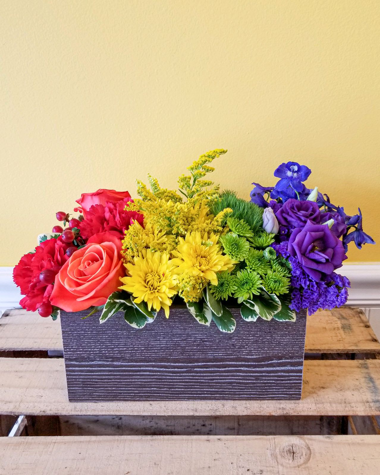 The Colors of Love - With a rainbow color pallete, this arrangement has everything from bold reds to vibrant violets, and the all gorgeous hues in between! 