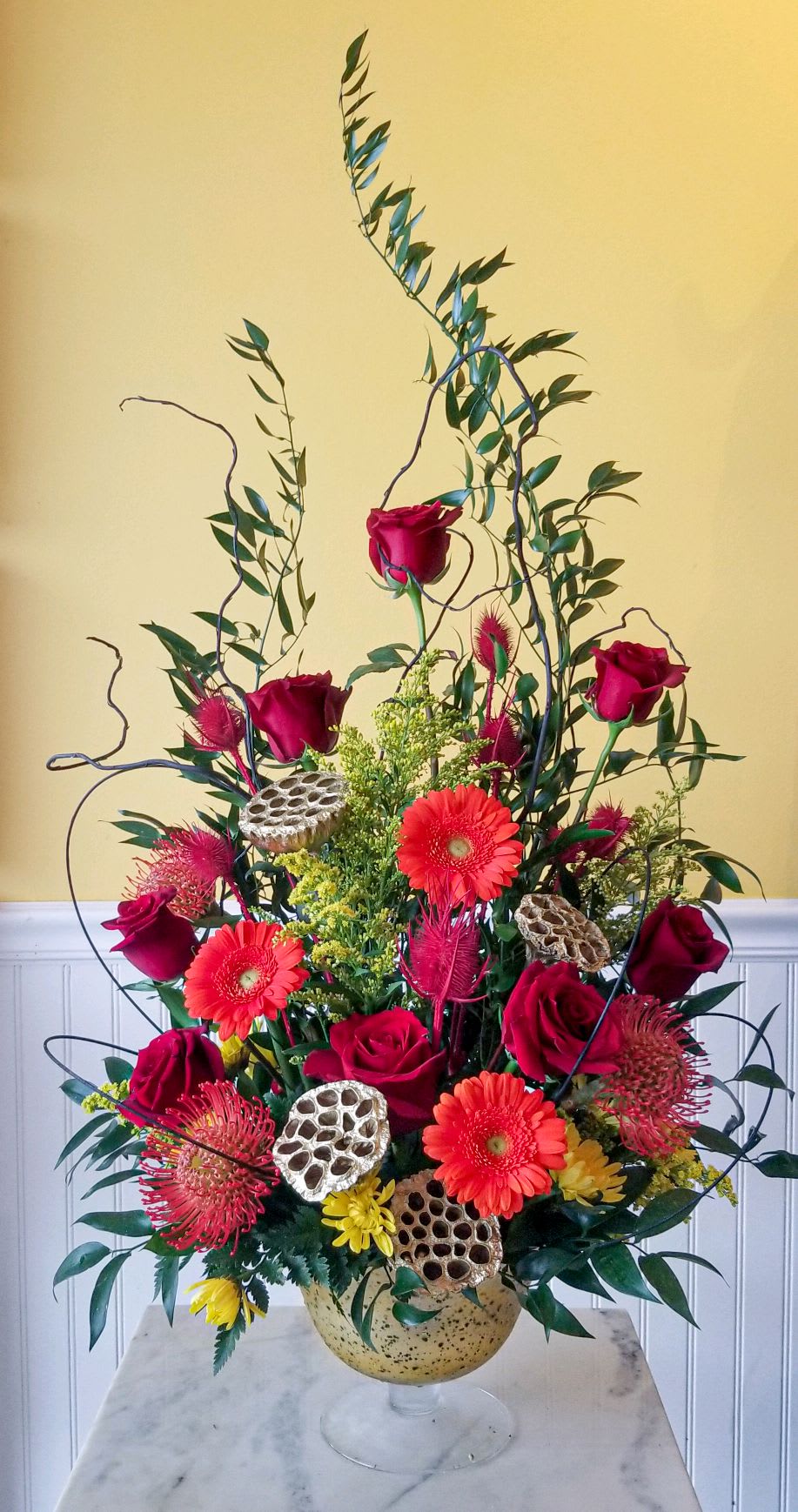 Luxury Line - Elements- Fire - This addition to our elements line captures the amazing colors of fire to include reds, oranges and yellows in a large gold mercury goblet vase.