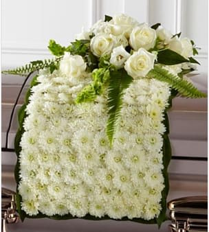 The FTD® Blanket of Flowers™ - The FTD® Blanket of Flowers™ is a beautiful adornment for the top of their casket at the final farewell service. White chrysanthemums form a blanket of blooms that drape across the casket accented with an arrangement of white roses, white double lisianthus, Bells of Ireland, ivy, sword fern and a variety of lush greens to create an exquisite look of sweet serenity to honor the life of the deceased. GOOD blanket is approximately 48"L x 16"W Your purchase includes a complimentary personalized gift message. 