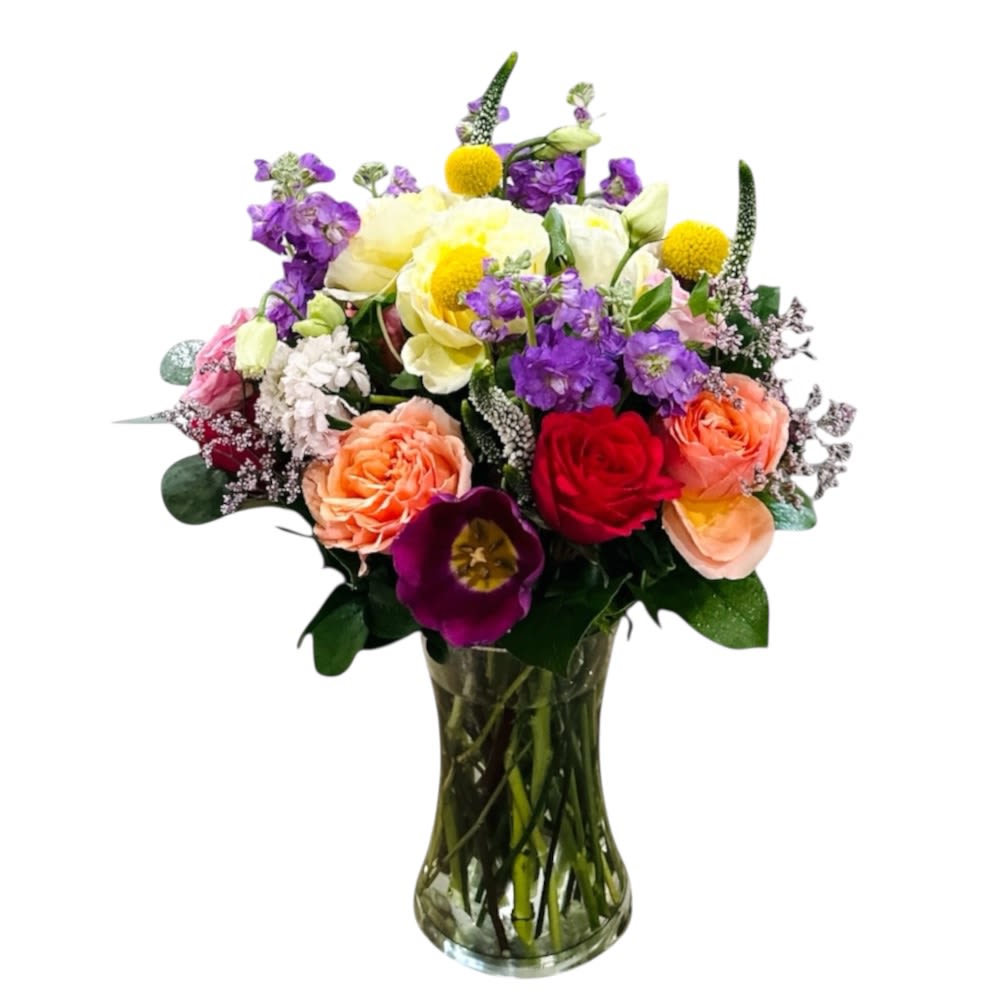 Cherished Garden | Luxury Garden Style Rose Arrangement - Cherished Garden  A luxury garden-style arrangement featuring premium coral, red, peach, and cream roses accented with vibrant purple blooms and golden billy balls. Designed in a clear glass vase with lush greenery, this colorful floral bouquet is perfect for birthdays, anniversaries, or sending love in a bold, elegant way. Fresh, romantic, and beautifully handcrafted.   