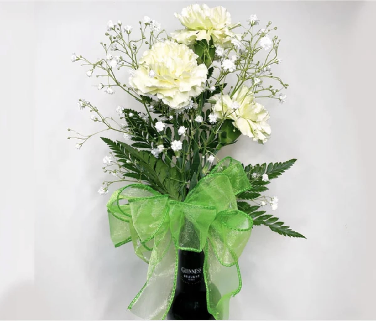 Happy St Patricks Day - Carnations mum , babies breath in a Guiness Bottle to celebrate the day.