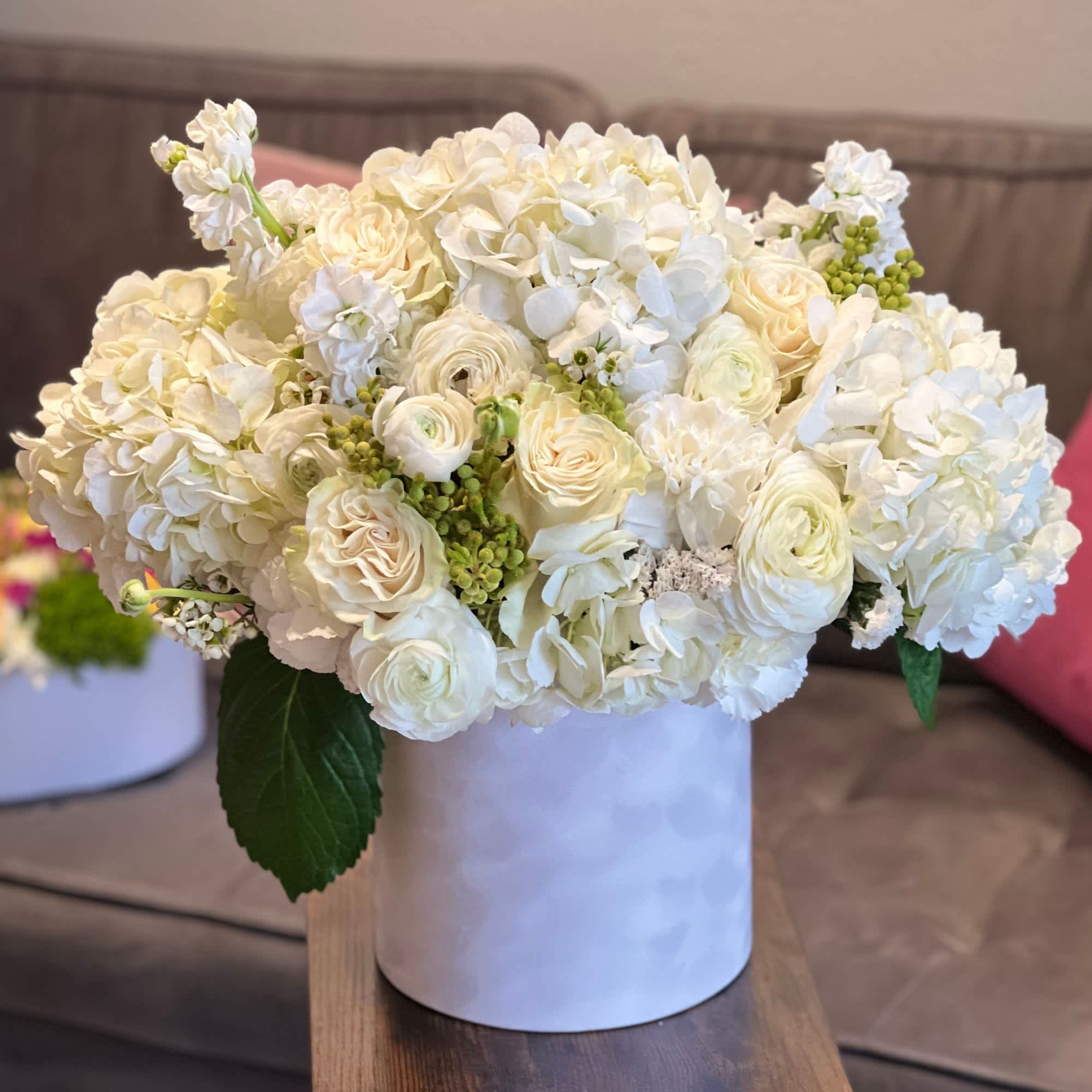 Winter Happiness - White flowers (hydrangea, roses, carnations, stock) mixed in a velvet white box
