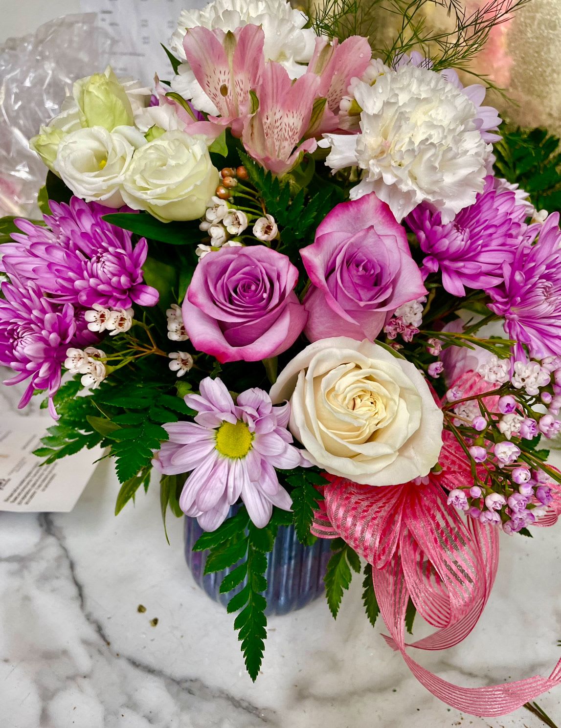 Sunday Afternoon by Lotherington's - This arrangement is a sweet surprise for any recipient. Featuring a selection of whit, pink and purple flowers, this arrangement is springtime in flower form and a great gift for anyone.  ***Colors and blooms maybe substituted depending on season and availability ***