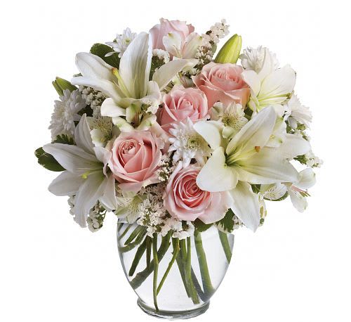 Arrive In Style Bouquet - Share your sympathies with a beautiful combination of light colors and lovely flowers. Light pink roses, white asiatic lilies, alstroemeria, cushion spray chrysanthemums  are delivered in a clear glass vase.