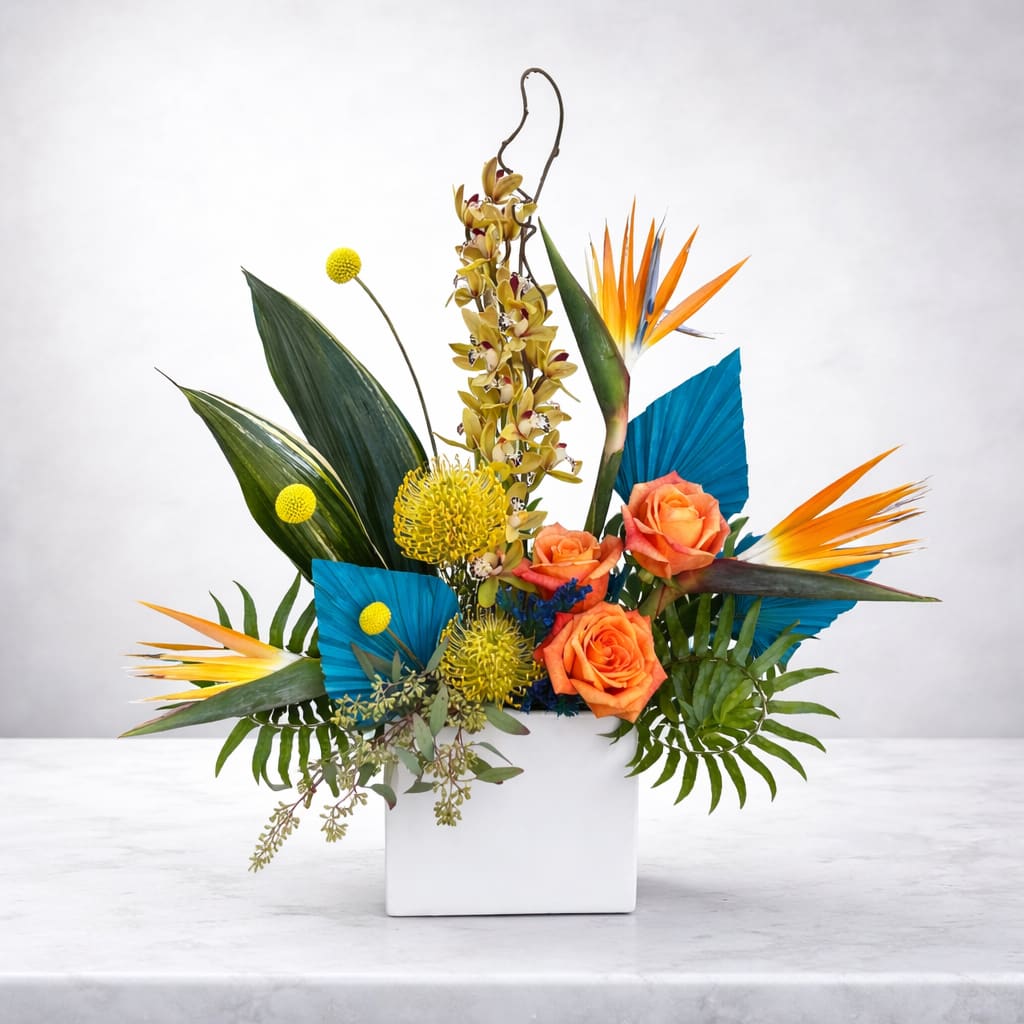 Playful Paradise - This whimsical and jubilant tropical arrangement is perfect for any bird of paradise lover. Flourishing with vibrant hues and exotic textures in a highly stylized design. Elevate your space with this captivating blend of artistry and nature, curated just for you.