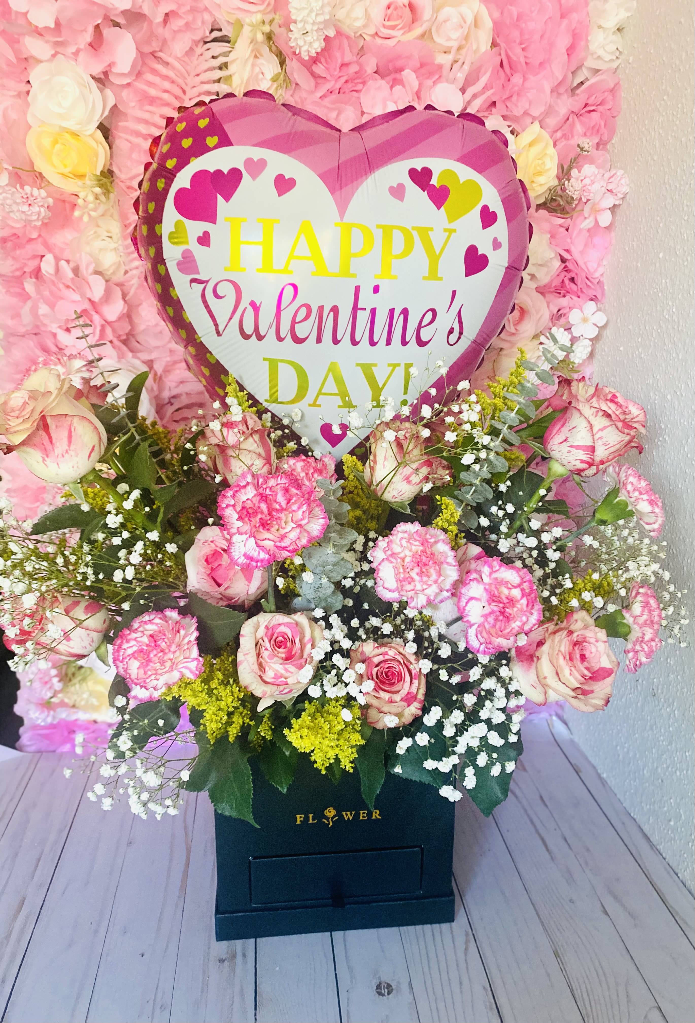 Pink Rose Bloom Arrangement - 12 pink roses, greenery, baby breath and pink carnations. Tones of PINK rose may change depending on availability. 4 chocolate strawberries (decoration chosen by designer) 