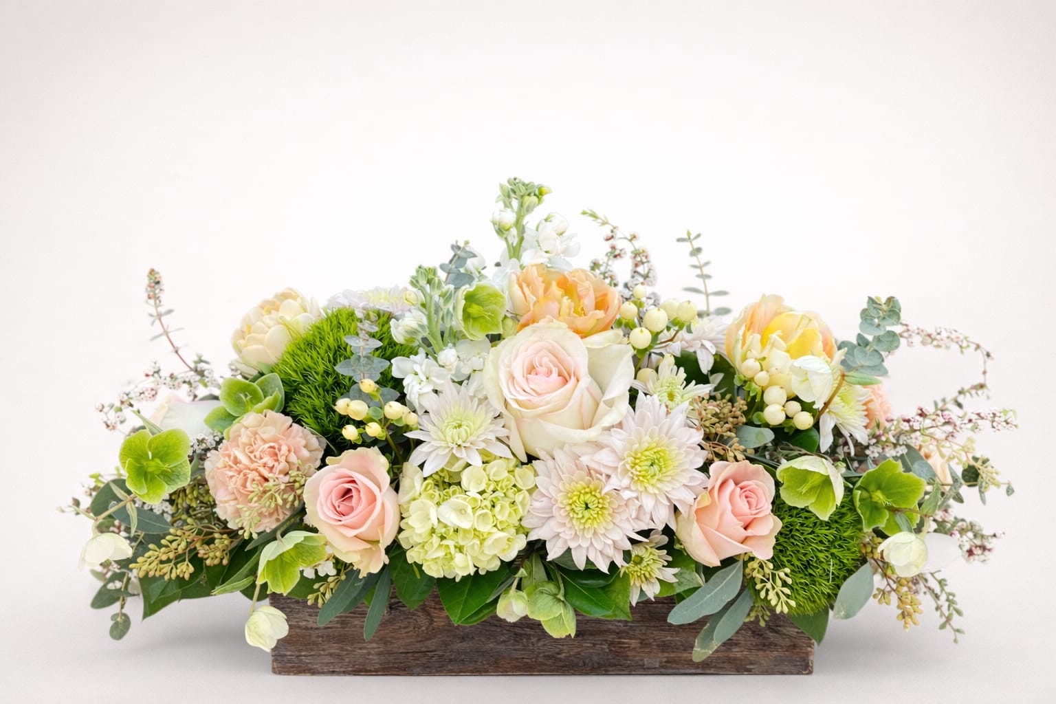 Tea Time - A gentle garden palette featuring hellebore and heather, stock, roses, and hypericum berries presented in a rustic wooden box. The perfect centerpiece for your next garden tea party or a soothing embrace for a grieving friend. 