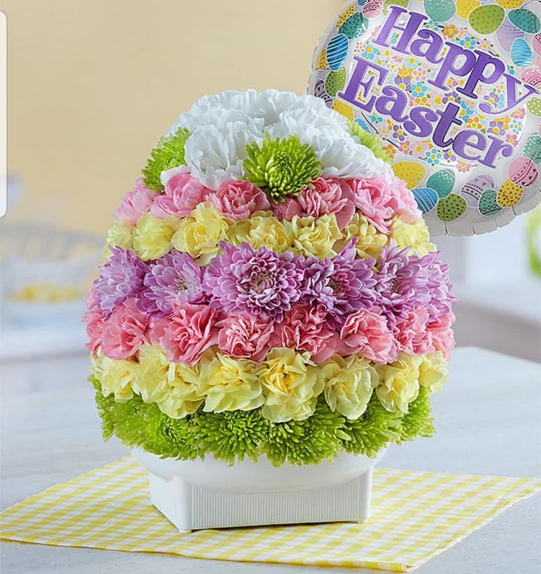 Eggstravagant  - This spring colored floral egg is perfect for your Easter get together. We use only the freshest flowers available. Floral varieties include mini carnations and chrysanthemums. 