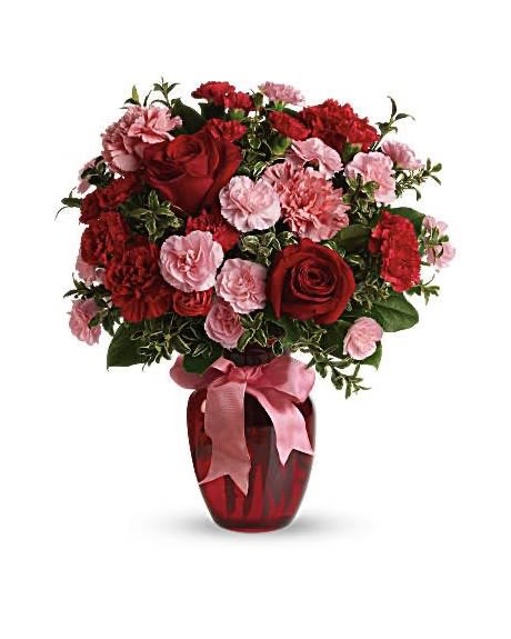 Romance Bouquet - A romantic mix of deep red and soft blush blooms with fresh greenery, designed in a rich red keepsake vase.   Each piece is Designer’s Choice, created with fresh seasonal blooms. Flowers and colors may vary based on availability while maintaining the overall style and quality.  Perfect for anniversaries, love, birthdays, and meaningful moments.