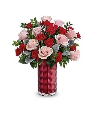 True Love Rose Mix - A romantic mix of blush and red roses, perfectly arranged with fresh greenery in a luxe faceted red vase. It’s a heartfelt gift filled with warmth and elegance.  Each piece is Designer’s Choice, created with fresh seasonal blooms. Flowers and colors may vary based on availability while maintaining the overall style and quality.   Perfect for: Valentine’s Day, anniversaries, Mother’s Day, romantic occasions 