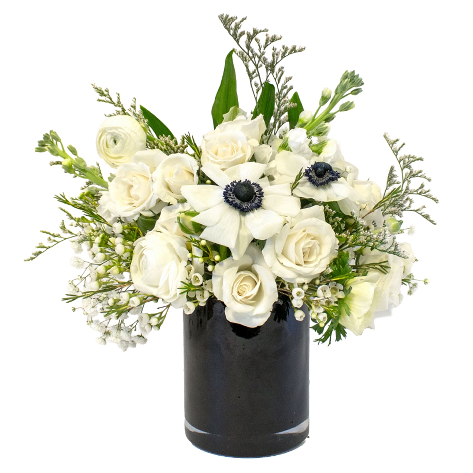 The New You - Start the new year off fresh with a classic black and white themed arrangement.  Containing ranuncula, anemone, spray roses, stock, and waxflower in a black glass container, this is sure to bring a touch of class to any space.