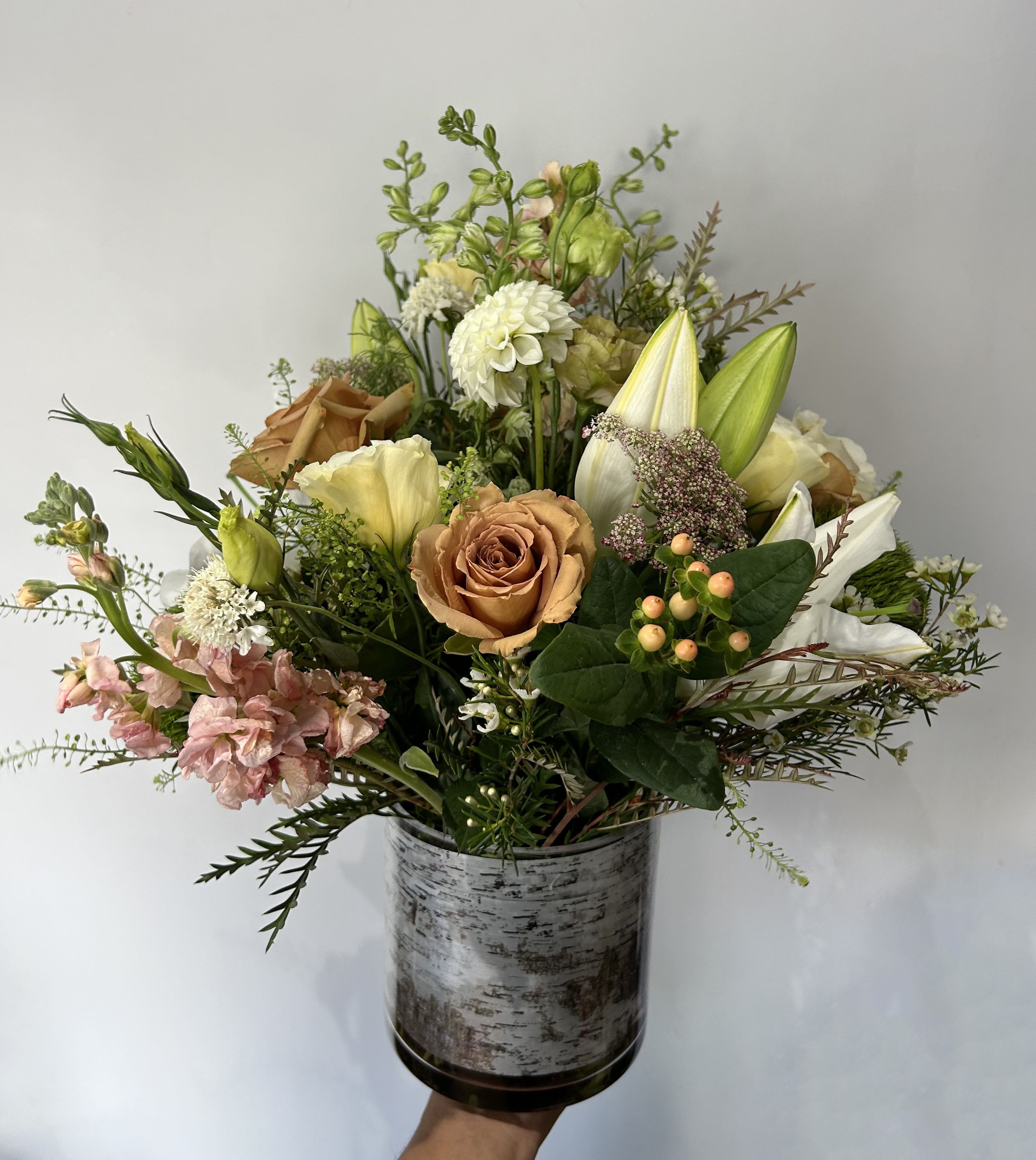 Toffee Latte  - Seasonal white and pastel flowers arranged in a vase. 