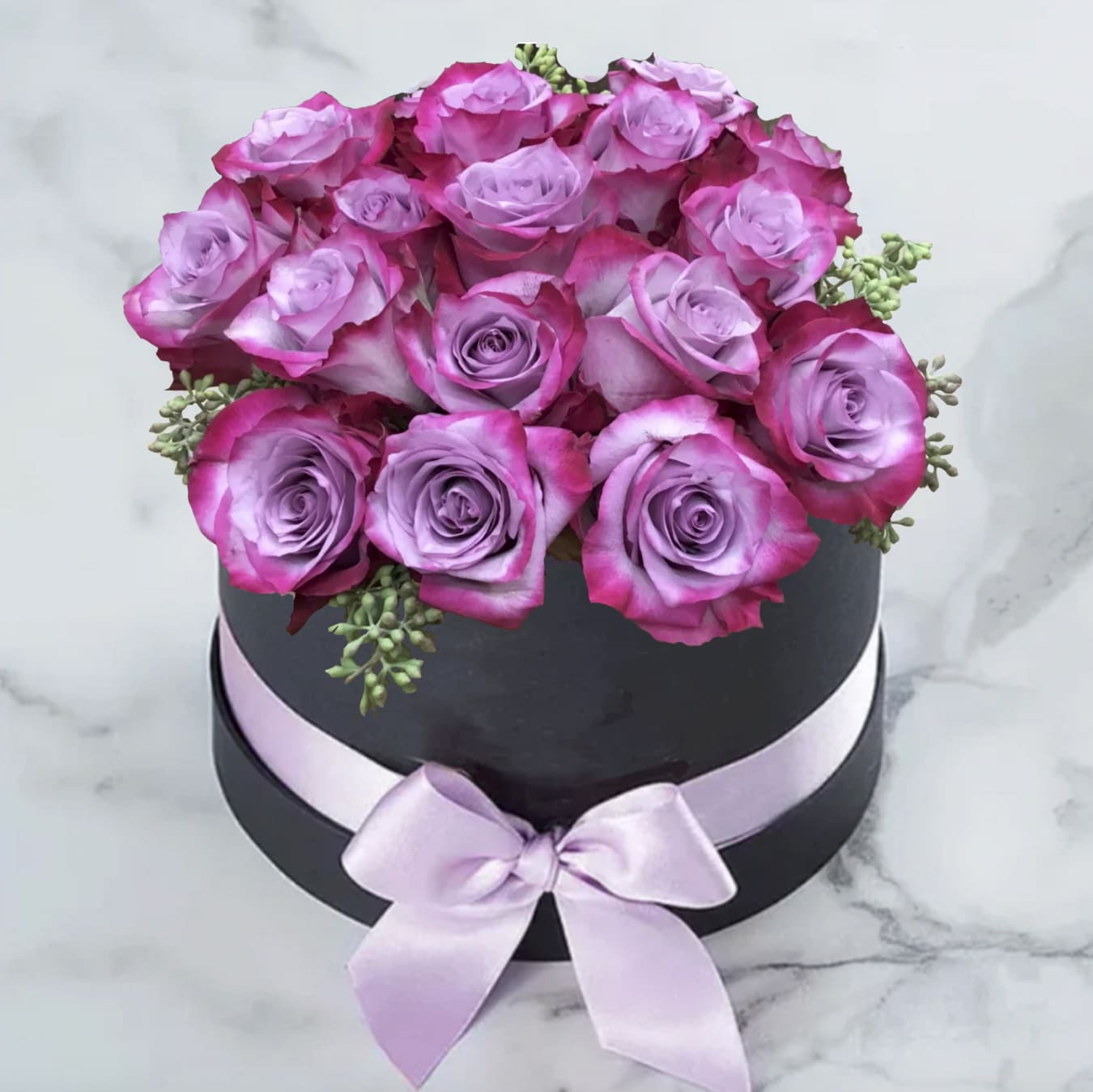 Black or White Box - 1 dozen roses..Variety of roses available , variety of hat box colors available (red, white, black , lavender.) you can choose your style and colors. ex: white roses in a black box, or red roses in a white box.. SHOWN,: IS DEEP PUPRLE ROSE IN A BLACK BOX WITH RIBBON 