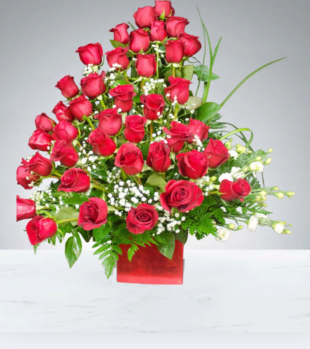 Love Galore  by D'Lily's Flowers  - This is an elegant front sided arrangement displayed by red roses to show some love to the ones you care for. Picture display's Premium.  