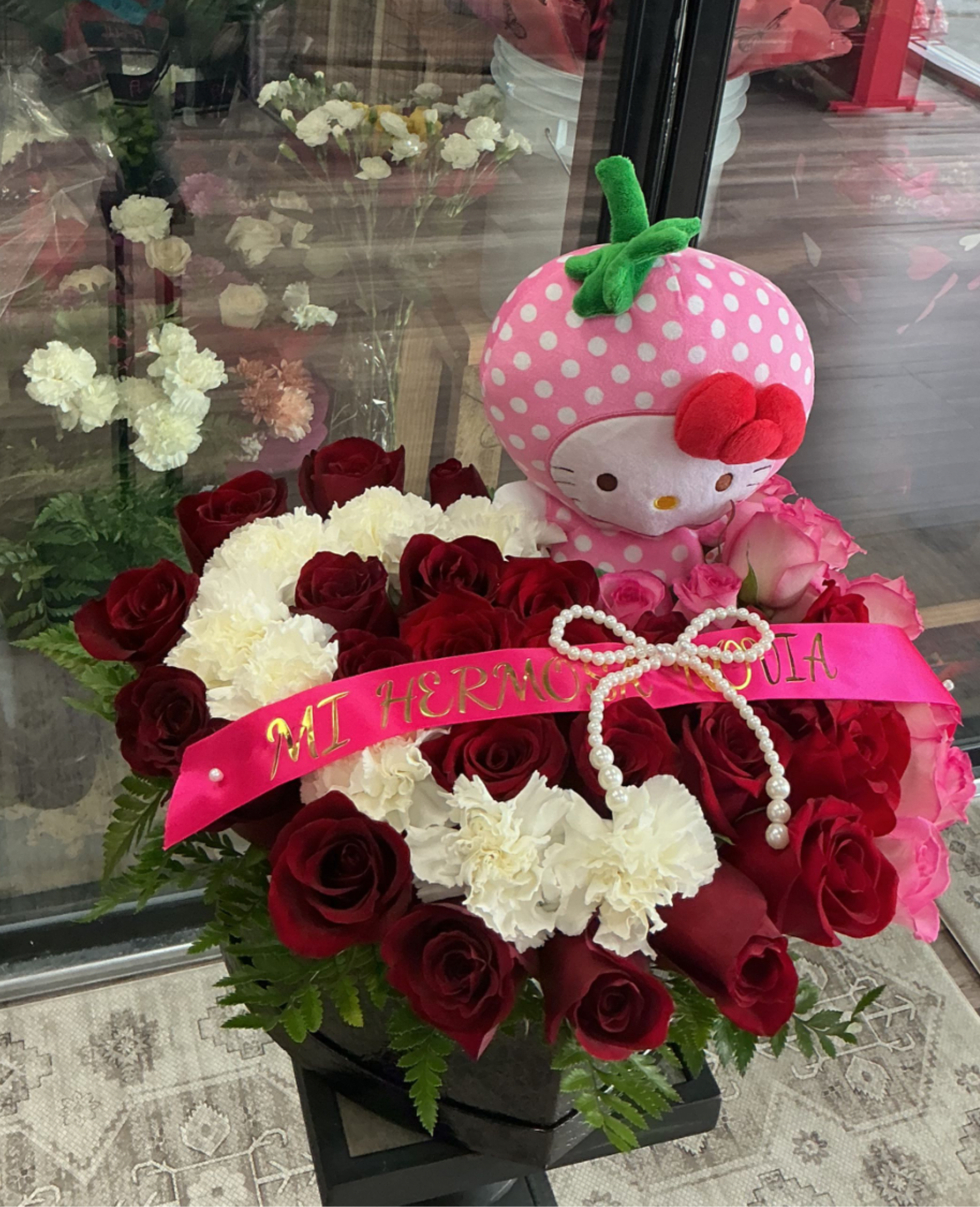 "Lovely Heart" Rose Box - A great arrangemt,made of leather ,carnation , roses and a beautiful plushie of hello kitty  you can cotumize as you like .
