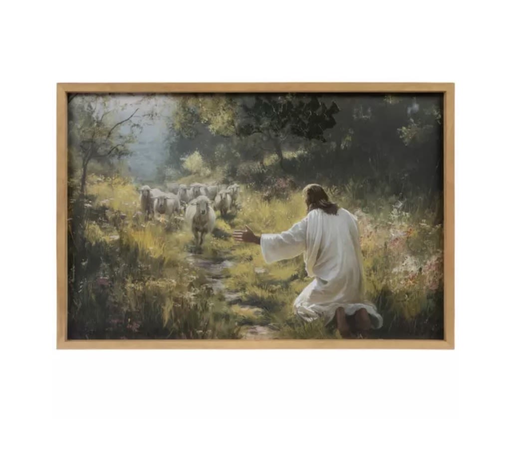 Jesus &amp; The Flock Wood Wall Decor - Point others to your Savior by displaying Jesus &amp; The Flock Wood Wall Decor in your space. This wall accent features a painterly print of Jesus excitedly welcoming a flock of sheep back to himself. Jesus is seen wearing a white robe as he kneels in the grass at eye-level with the flock coming toward him. The piece is complete with a light brown wooden frame and white gel accents for a hint of dimension and more texture to the artwork. Display it in your living room, entryway, or lobby to greet guests with a meaningful message and a beautiful scene.