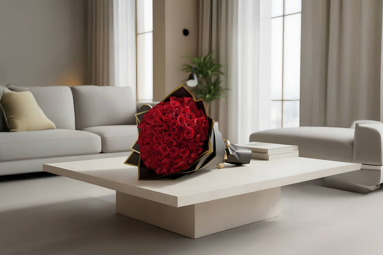 25 red rose wrapped bouquet   - 25 premium red roses, wrapped in a black and gold paper and a red ribbon. 