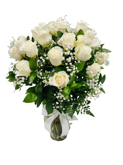 White Roses in a clear vase VALENTINE SPECIAL!! - White roses in a vase with greenery and baby's breath.  Standard: One Dozen   Deluxe: Two Dozen   Premium: three Dozen  Pictures are for reference only.  
