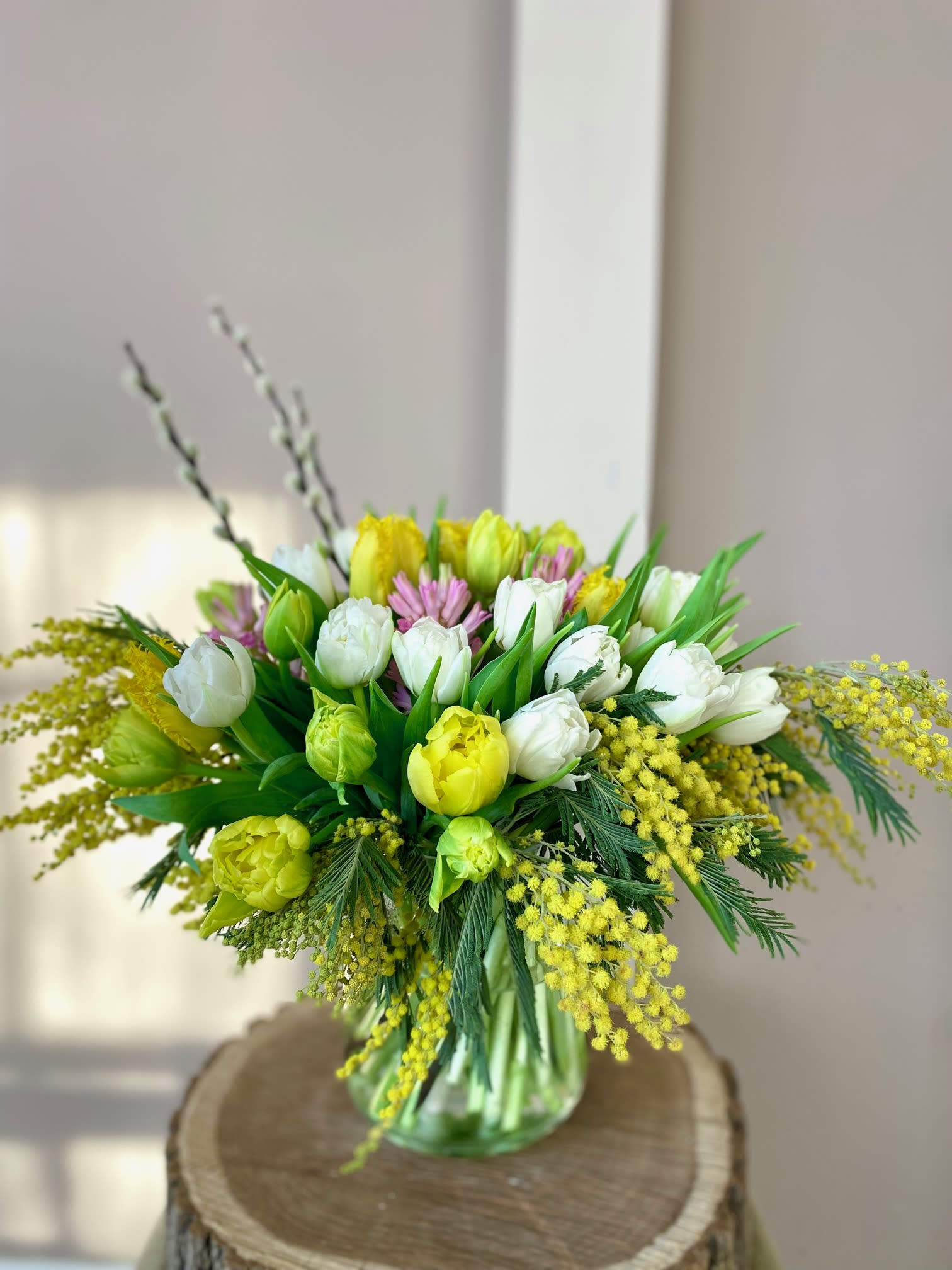 Shine bright like a Tulip - A gorgeous bouquet of 40 tulips (and fragrant hyacinth!). The variety and color of tulips and hyacinth may vary based on availability.  Nicely arranged in a glass vase. 