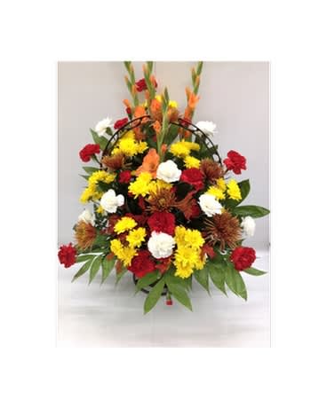 Sunrise Basket - This simple yet beautiful basket captures the colors of a sunrise. Mums, carnations and glads arranged together.  Flowers and colors may be substituted depending on availability.   FCF-SF01