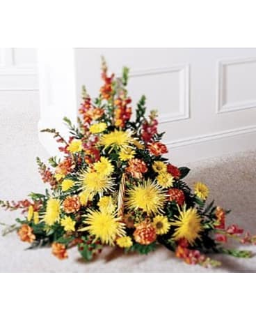 Timeless Tribute Basket - This lovely arrangement is a magnificent display of yellow and orange blooms amidst assorted greens. Appropriate for the chapel or funeral home.   FCS20-3151