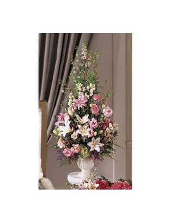 Simply Restful - Pink and white lilies larkspur snapdragons and lisiathus are arranged in a graceful display. The arrangement is accented with other pink and white blooms and delivered in a ceramic urn. Appropriate to send to a home or to a funeral. Approx. 34.0h x 21.0w   FCS19-3562
