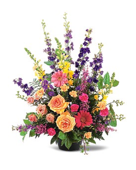 Most Memorable Tribute - This outstanding arrangement of vibrant seasonal flowers offers your condolences in a most memorable way. A mixture of hot pink gerberas peach carnations and spray roses purple larkspur and yellow snapdragons in a green jardiniere. Approximately 26" W x 31" H   TF183-1