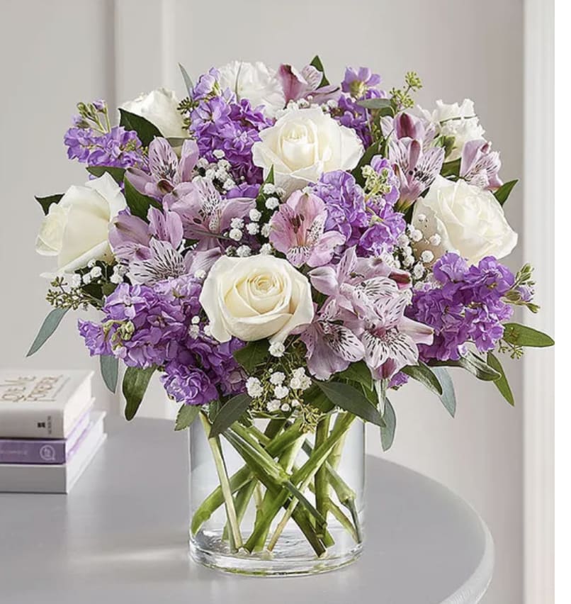 Lovely Lavender - Lovely memories are made with thoughtful gifts for the ones we care about. Our charming lavender flower bouquet is loosely gathered with a medley of lavender &amp; white blooms. Hand-designed inside a clear cylinder vase with cascading greenery all around, it’s a wonderful way to express the sentiments you have inside your heart. Please note the bouquet pictured reflects our original design for this product. While we always try to follow the color palette, we may replace stems to deliver the freshest bouquet possible. 