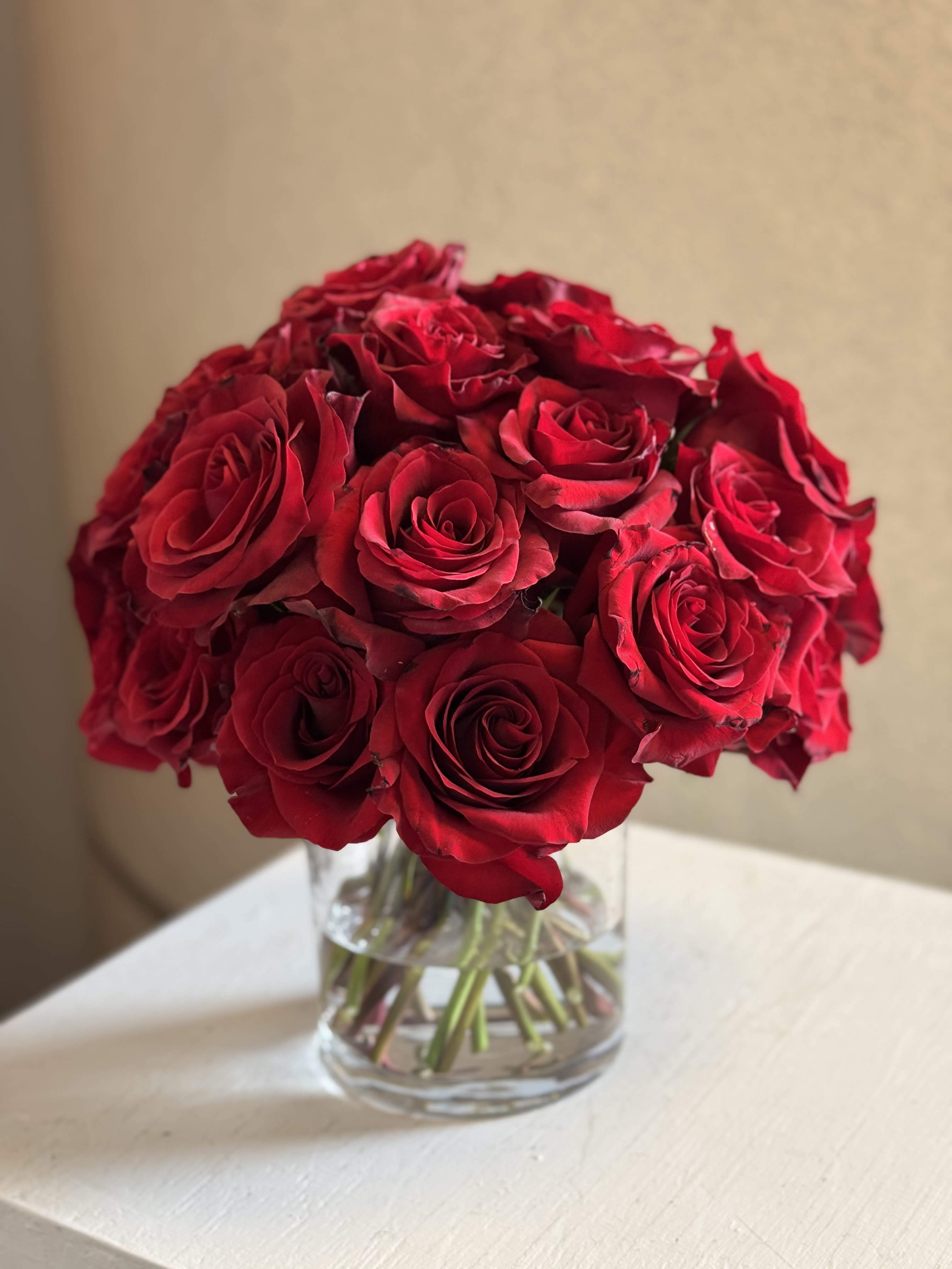 Classic Crimson Rose Arrangement - A timeless bouquet of premium 30 stems of red roses beautifully arranged in a clear glass vase. Each bloom is hand-selected for rich color, full petals, and long-lasting freshness, creating an elegant statement piece for any space. Perfect for anniversaries, romantic gifts, Valentine’s Day, or home décor.