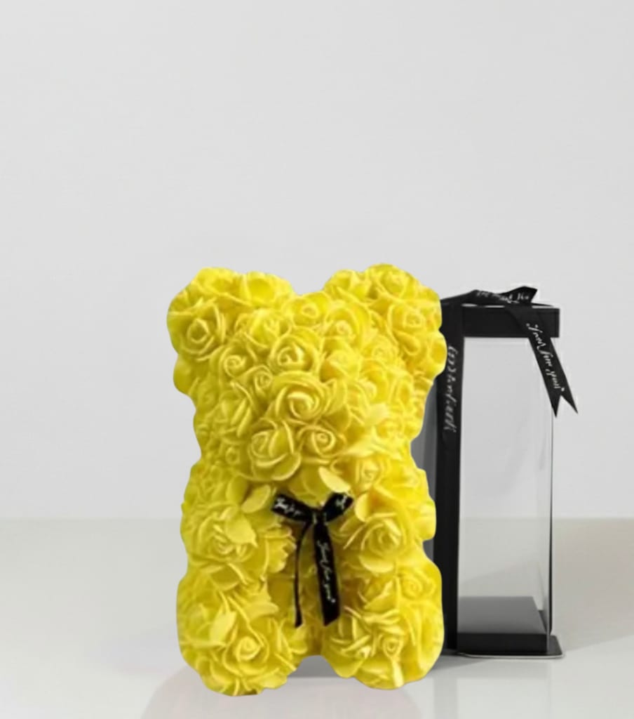 Yellow Rose Bear in Transparent Gift Box - Celebrate love in the sweetest way with our Yellow Rose Bear, handcrafted from dozens of delicate foam roses to create a timeless keepsake that never fades. Presented in a clear display gift box tied with a ribbon, this romantic rose bear is the perfect gift for birthdays, anniversaries, Valentine’s Day, Mother’s Day, or just because. A symbol of elegance and affection, this luxury rose bear from Je’ La Diamond Luxe Gifts makes every occasion unforgettable. 