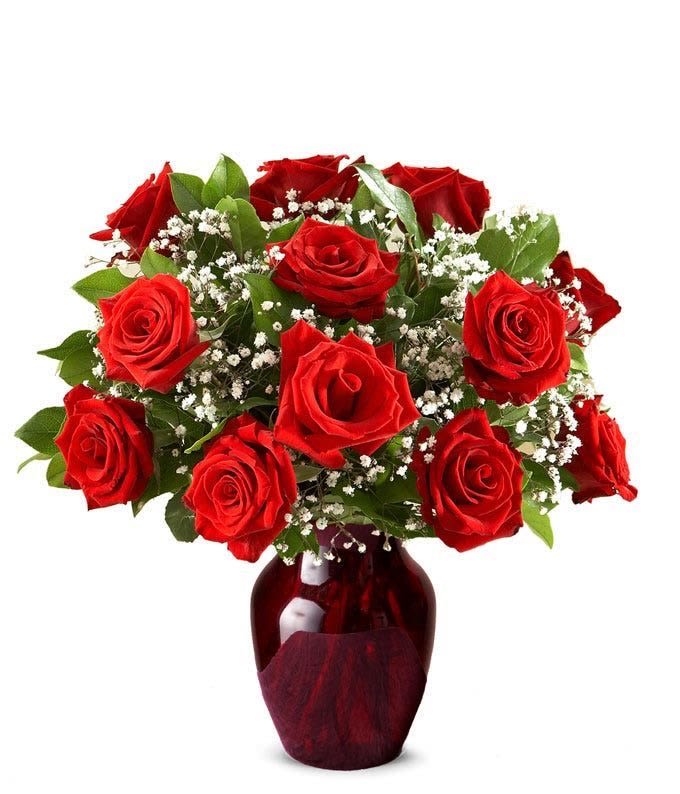  Premium Red Rose Vase - Full, lush red rose arrangement in a modern vase. Elegant and bold.