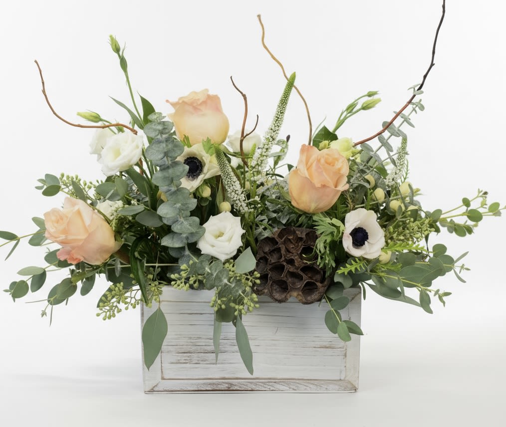 Stardust - This arrangement is oh so pretty. It contains veronica, roses, anemone, berries and more.