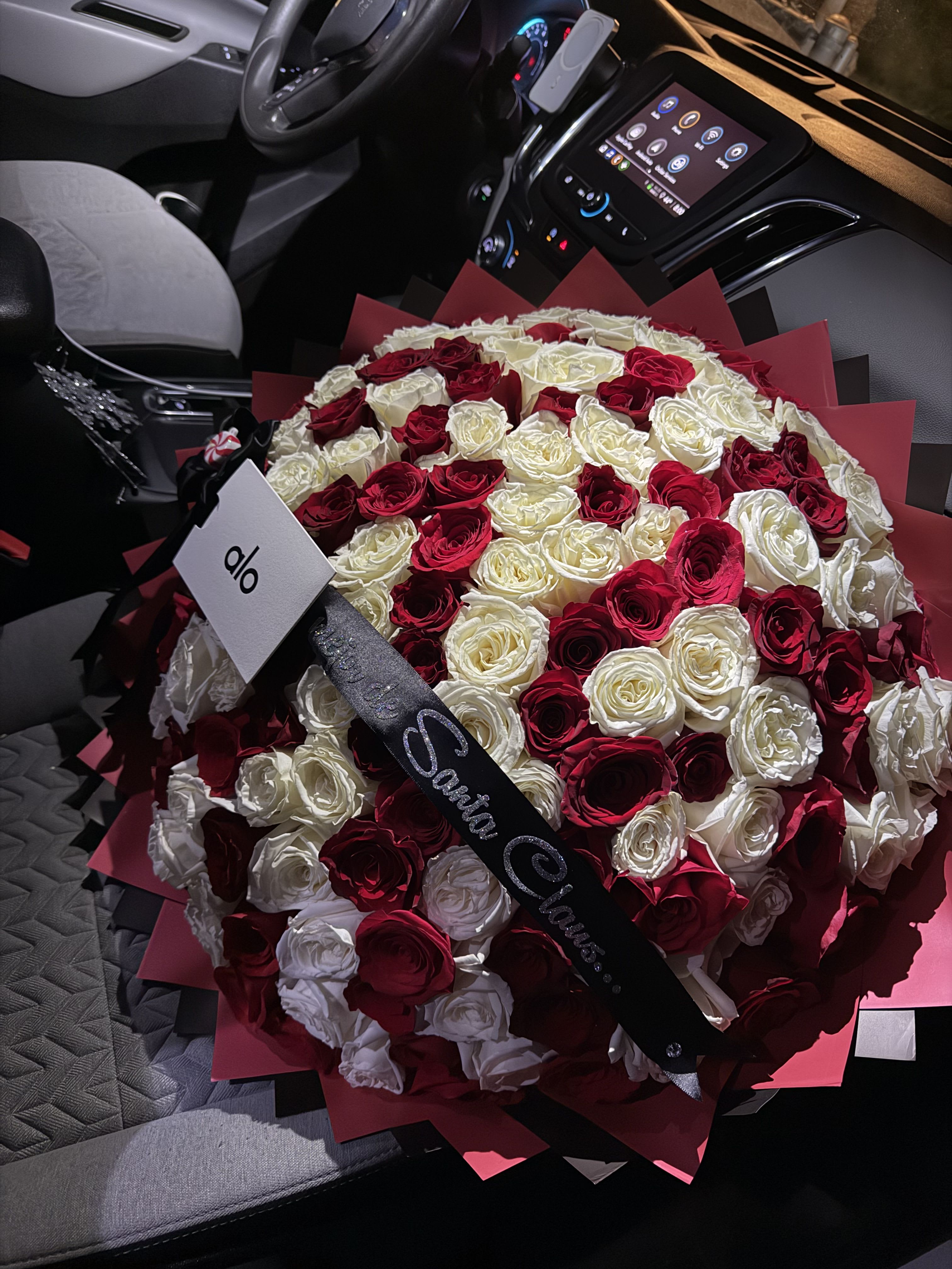 Alo Mega Buchon - This enormous and beautiful bouquet perfect to Wooow that special lady and leave her speechless and in shock.   -150 Red and White Ecuadorean Roses - custom ribbon (wording of your choice) -Must provide ALO gift card)  - Red and black wrapping paper(add special note if you would like to change color of wrapping paper.)     “NOTICE”  We are dedicated to delivering your emotional sentiments with the utmost care, ensuring that each arrangement is fresh, beautiful, and arrives on time. Due to the natural variability of flowers, as well as seasonal and regional availability, substitutions may occasionally be necessary. Rest assured, any substitutions will be of equal or greater value, and we will make every effort to preserve the overall design, including the shape, size, style, and color combinations of the arrangement. In the case of single-variety arrangements, the specific variety will take precedence over color to maintain the intended look and feel. Thank you in advance for understanding that flowers are a natural product and may vary slightly in appearance.