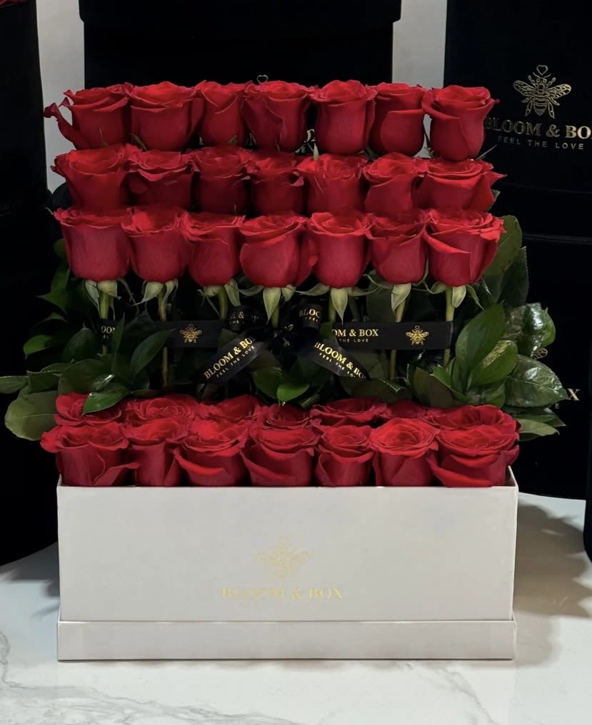 THE LOVE CASCADE - The rose cascade is designed to express abundant love and affection. Composed of 36 premium handpicked roses. 