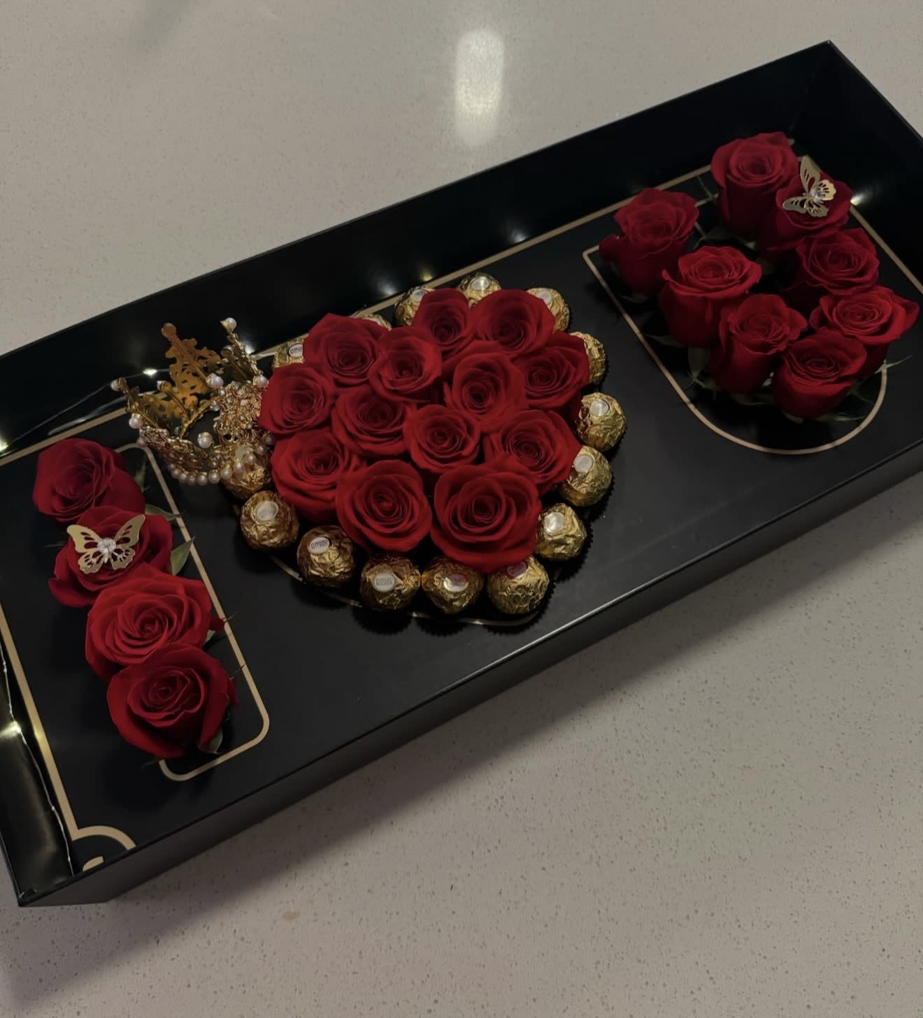 I LOVE U BOX - The I LOVE U box is designed to express abundant love and affection. Composed of premium handpicked  Ecuadorian roses, and Ferrero Chocolates and butterflies as well a small crown. 