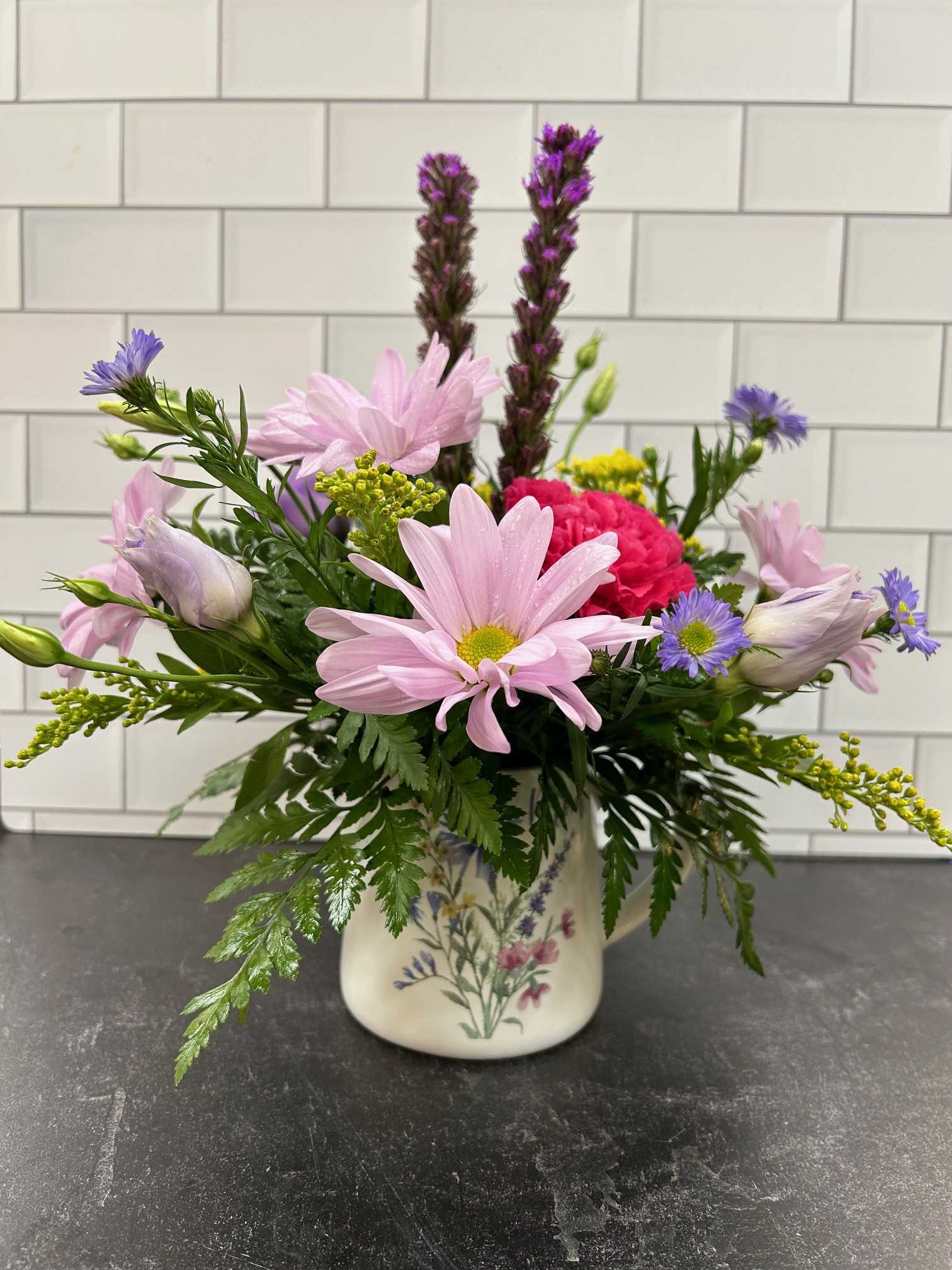 Cup of Joy - A sweet fresh arrangement with daisies, carnations and spring asters, this mug is sure to bring joy. 