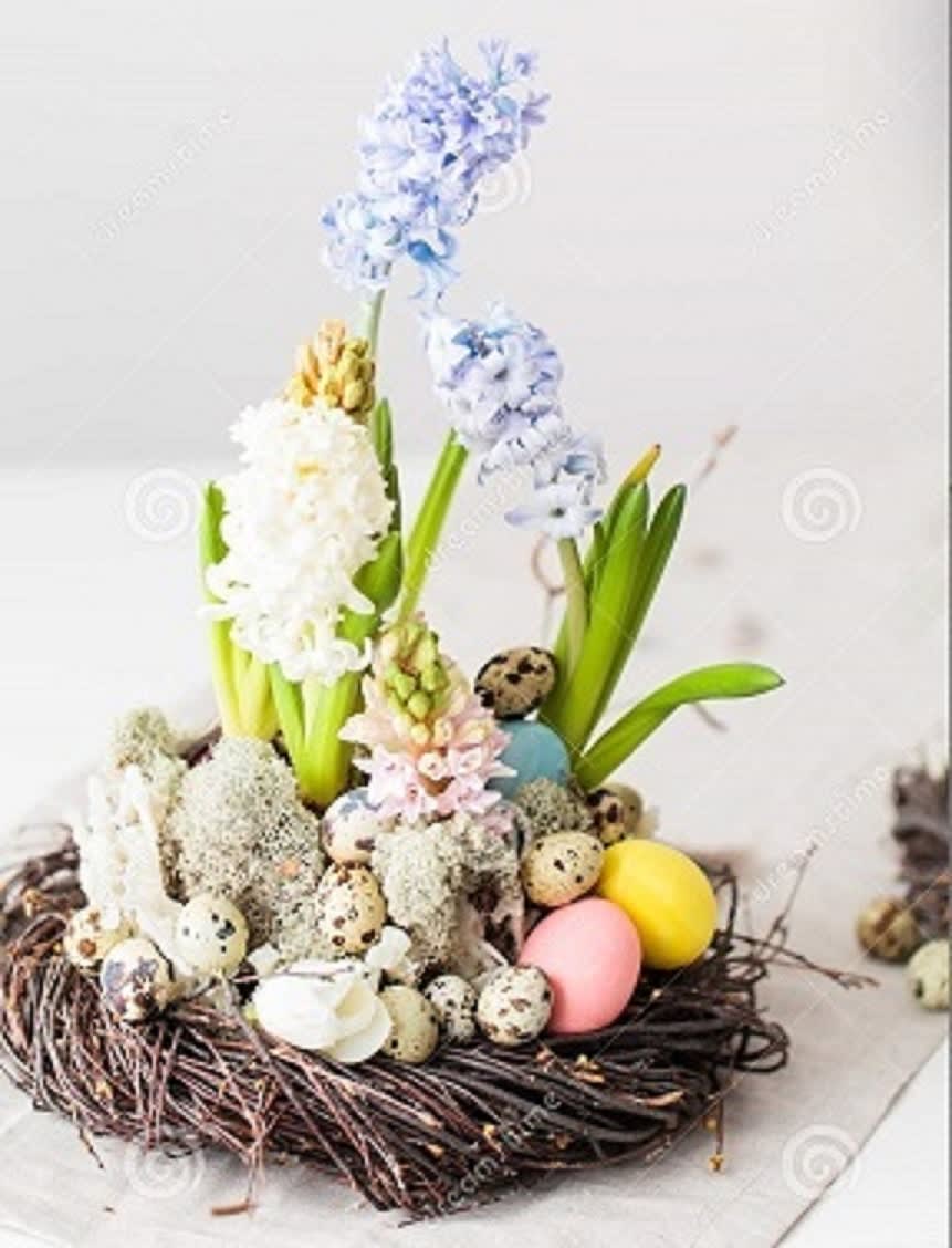 Easter Table Display  - Easter table arrangement with fragrant spring bulbs and eggs positioned in a nest. 