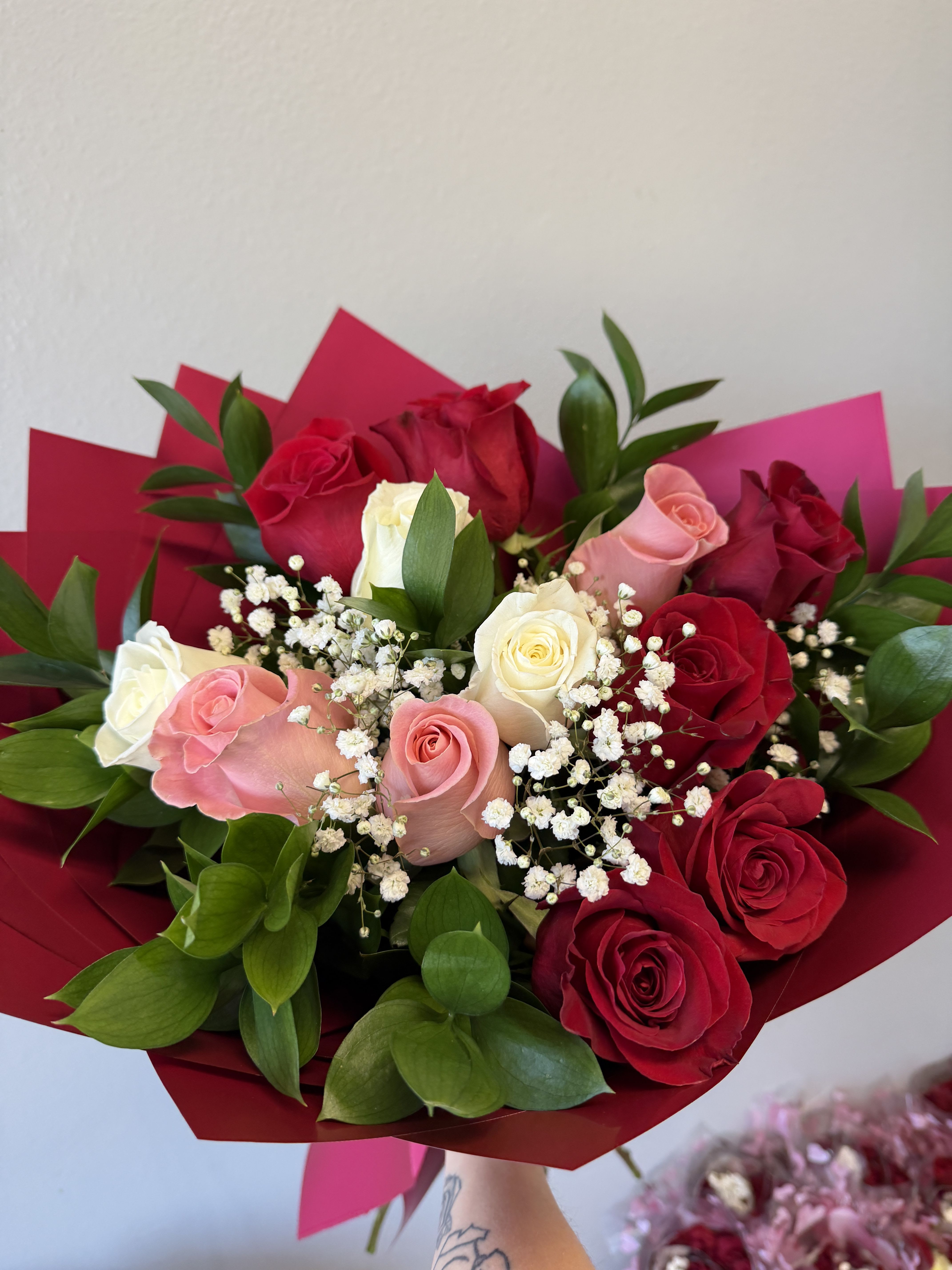 Premium dozen; valentines tricolor  - 1 dozen long stemmed premium roses in pink red and white with filler and greens