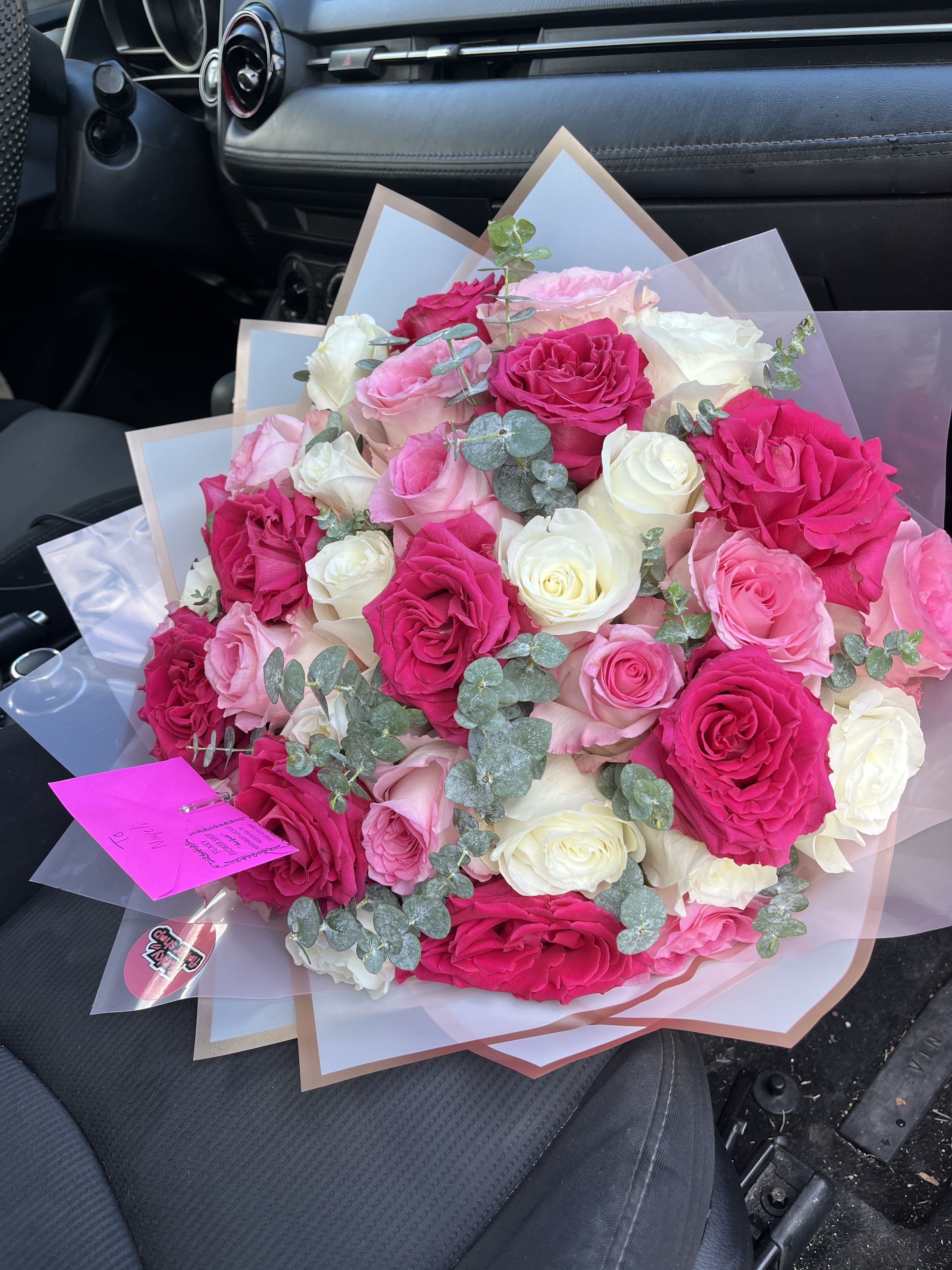 pink roses with eucalyptus - 3 dozen roses in white, light pink, and fuchsia