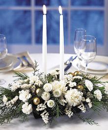 White as snow - This evergreen and floral centerpiece in all white with gold and silver accents is sure to be a beautiful addition to anyone's table.  Whether you are having Christmas dinner or entertaining for the holidays.  