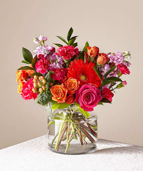 Fiesta Bouquet - The Fiesta Bouquet is composed of a lively mix, fit to celebrate any and every moment. With a combination of vibrant flowers, this florist–designed arrangement brings a pop of color and a burst of excitement as soon as it arrives.