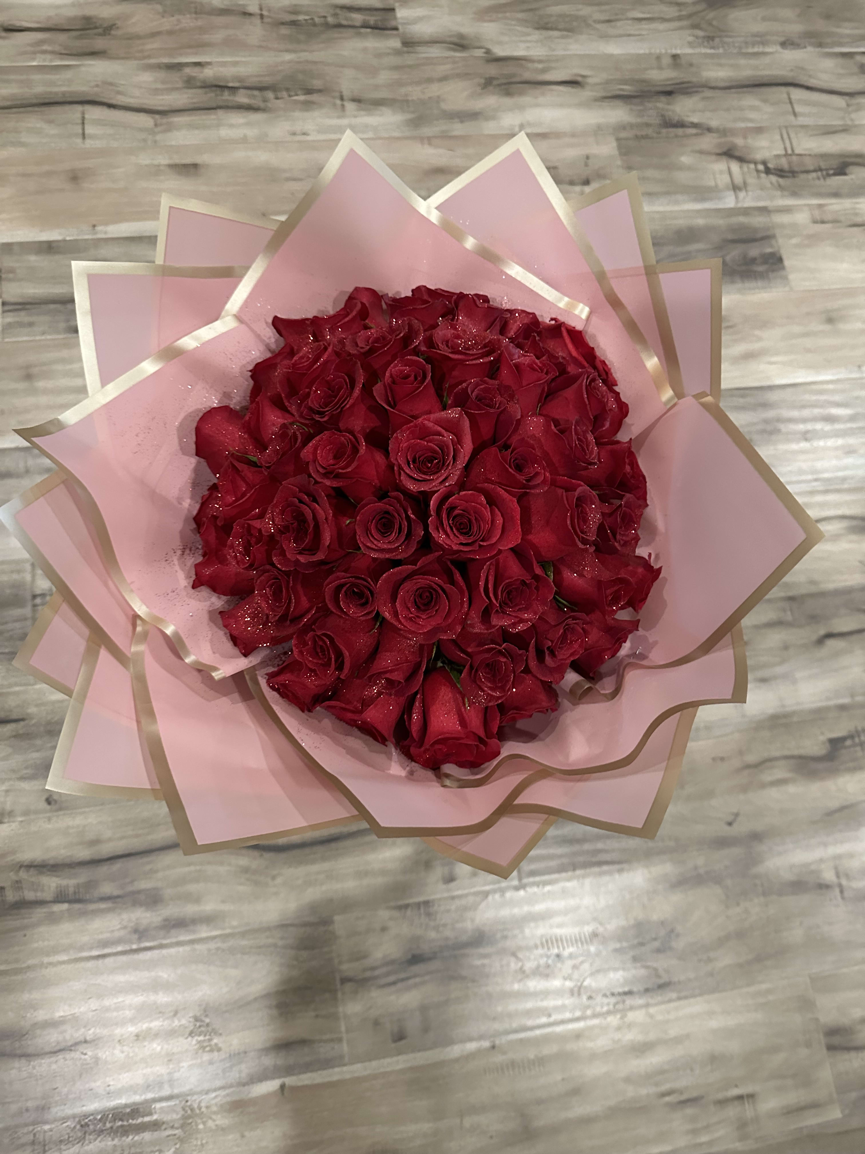 Red Princess - Standard: 50 Red roses with your choose color of wrapping paper. Premium: 50 Red roses with your choose color of wrapping paper. With small gold grown and 3 gold butterflies.