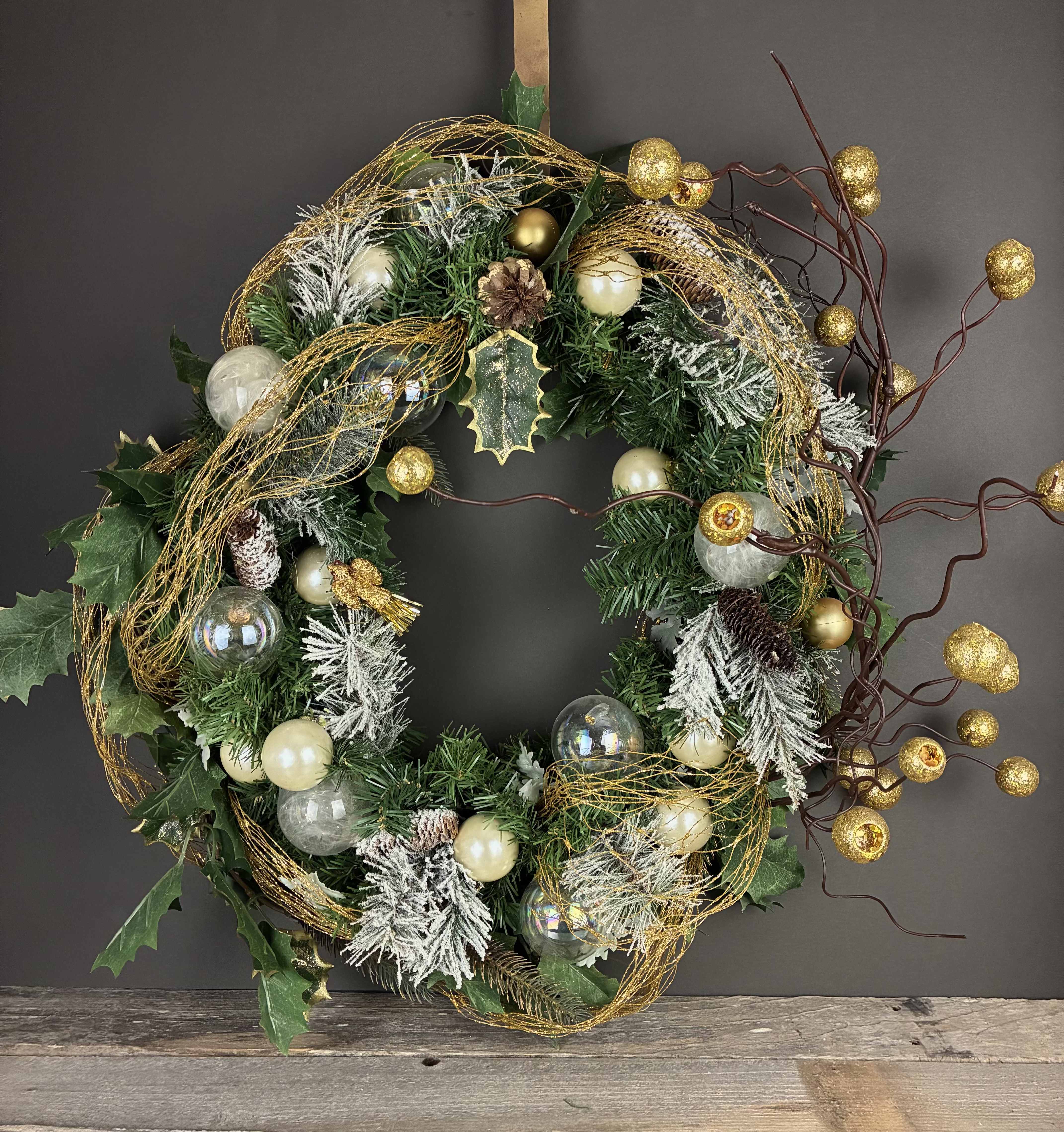 Christmas Glam Wreathe - This bold and sparkly wreathe is perfect for Christmas time! Measurements: 22in across All of our wreathes are hand made by our designers and we never make the exact same wreathe twice! If you would like a wreathe similar to this one, please call or email the shop.