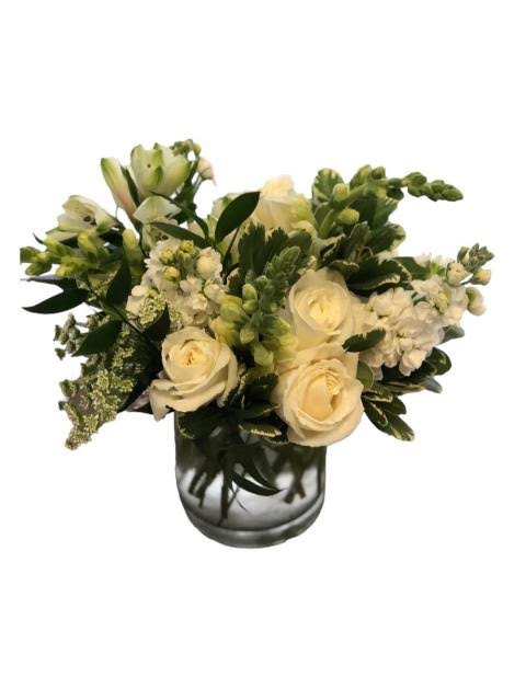 Classic White - A low and luscious bouquet of premium white flowers &amp; foliage.
