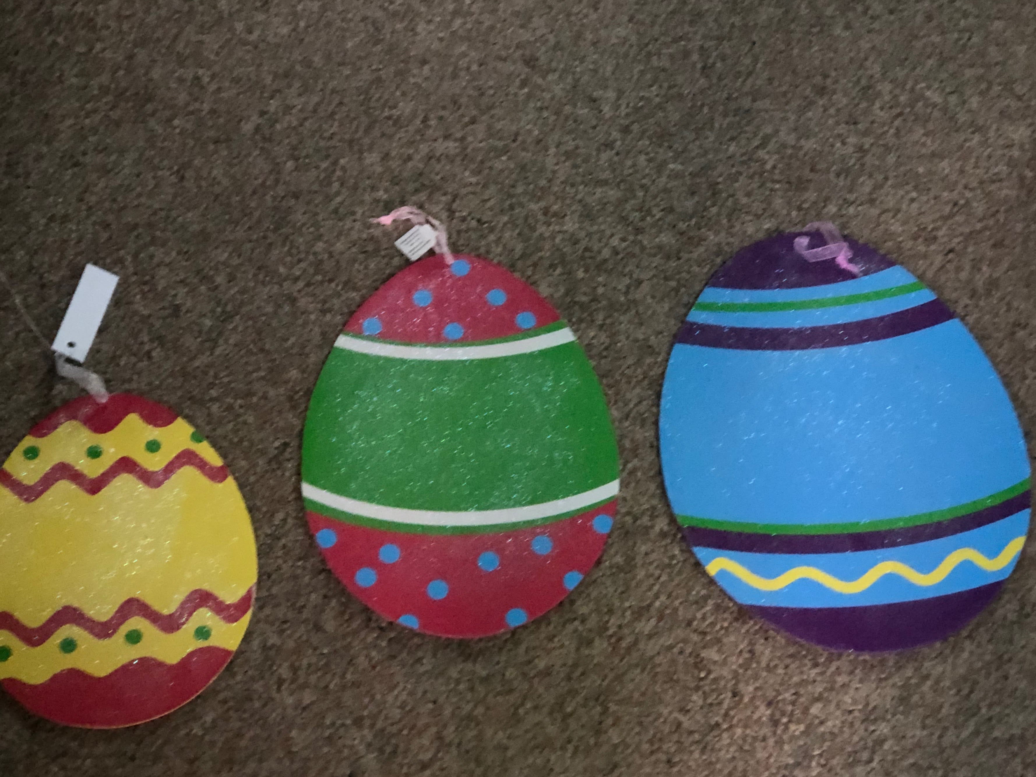 Easter Eggs Wall Decor - A wonderful addition to your wall or window. Three assorted glittered eggs in mixed sizes of 12", 14", and 16" with attached ribbon for hanging. Colored on both sides for viewing. (suction cups not provided.)
