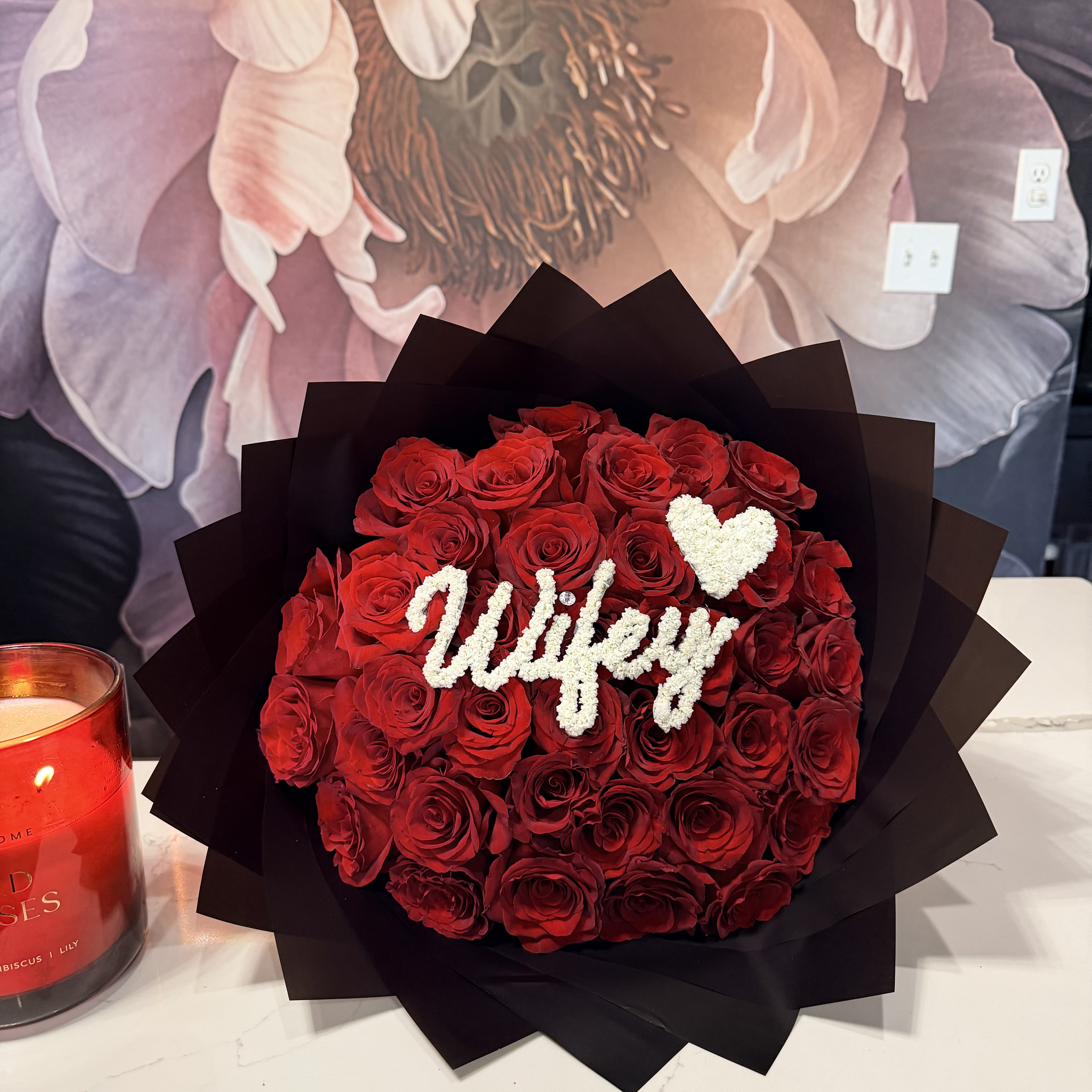 Wifey Bouquet - Leave your rose color choice in the florist notes at checkout: Red, hot pink, white, lavender, or light pink.  Roses, hand-crafted with “Wifey” spelled in real baby’s breath—plus a heart, because details matter. Designed to make her feel seen, spoiled, and entirely that girl.  This one's for the one. 