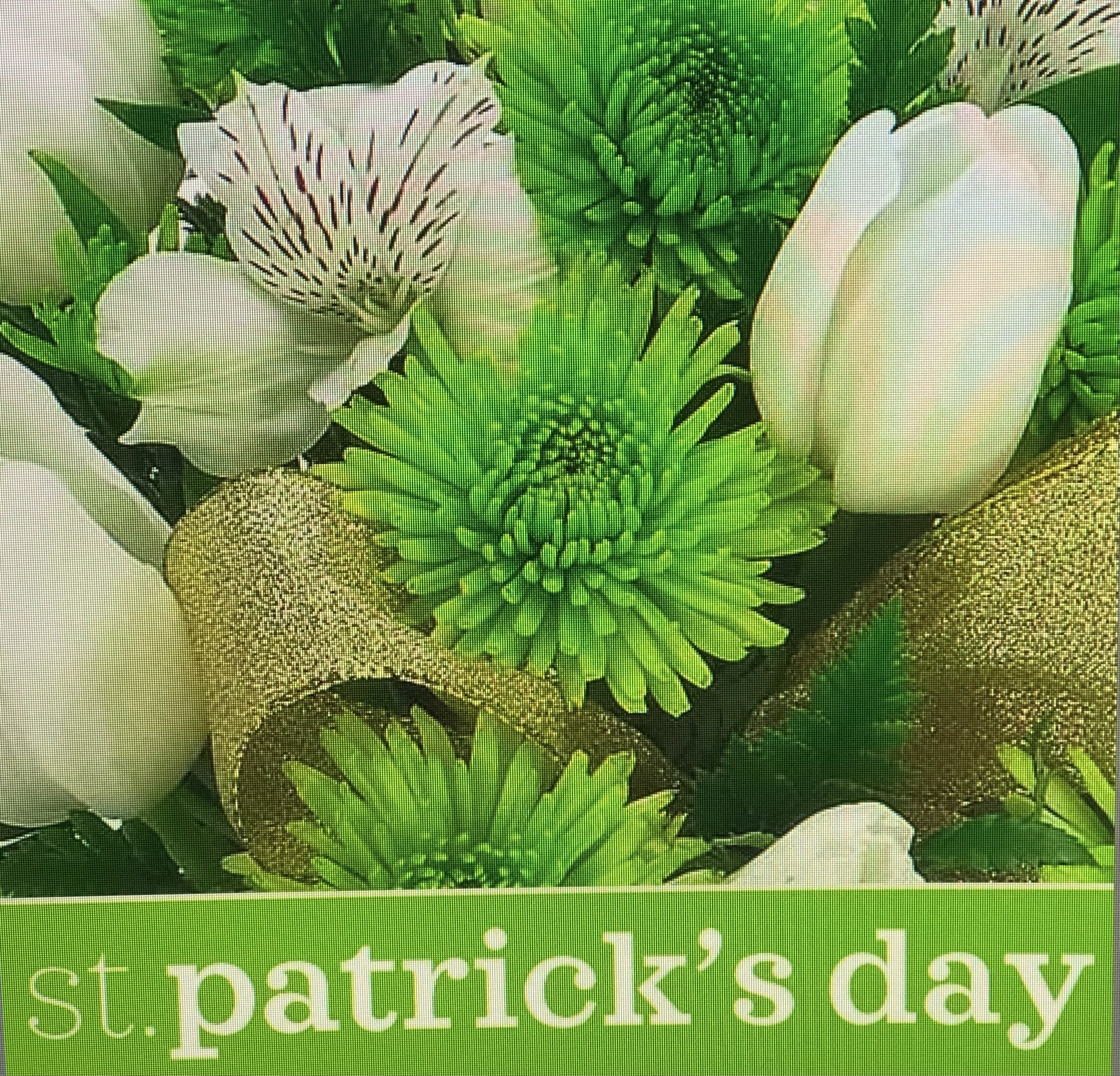 St. Patrick's Day Surprise  - For the love of Green. Happy St. Patrick's Day. Let our designer create a lovely green and white holiday arrangement that celebrates the early Spring season. Will come in a specially designed glass vase. You will be saying "Top of the Morning" to everyone you meet.