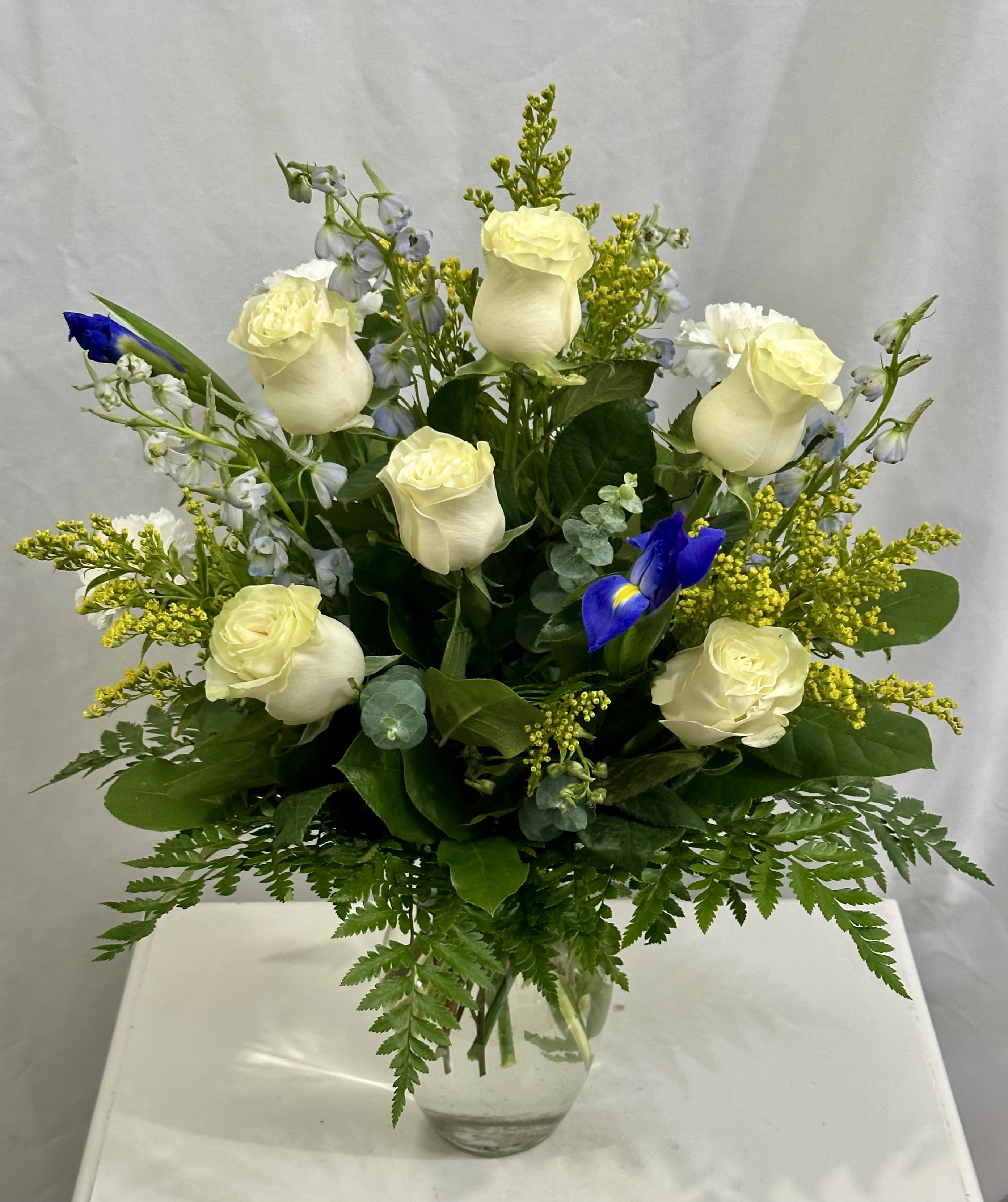 Blue Beauty  - Creamy Mondial Ecuadorian white Roses, light blue Delphinium, yellow Solidago, and blue Iris 