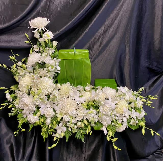 URN GARDEN.  UG # 5     All white.  with picture and urn riser  - All white —.  Cremons,Spiders &amp; Kiku Mums,  white stock,  Orchid sprays &amp; Lisianthus    placing for  picture frame and  platform for urn-   size of  picture  8" x 10"    urn  6"base