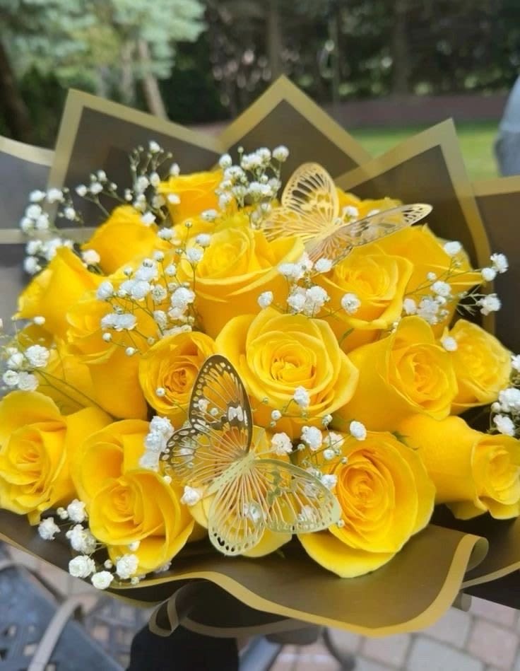 Golden Butterfly Rose Bouquet - Radiant yellow roses wrapped in luxury matte paper and accented with delicate baby’s breath and decorative butterflies for an enchanting finish. This bouquet symbolizes new beginnings, joy, and celebration — perfect for graduations, anniversaries, promotions, or “just because” surprises.